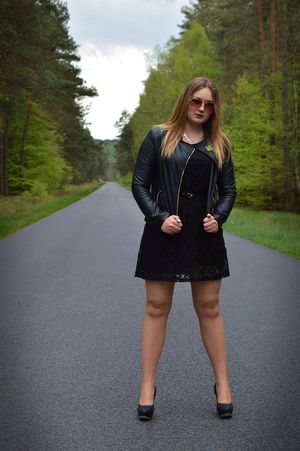 Curvy blonde hitchhiker on the road