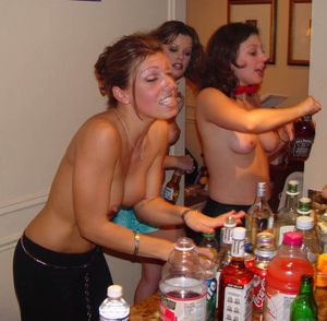 At party making drinks topless