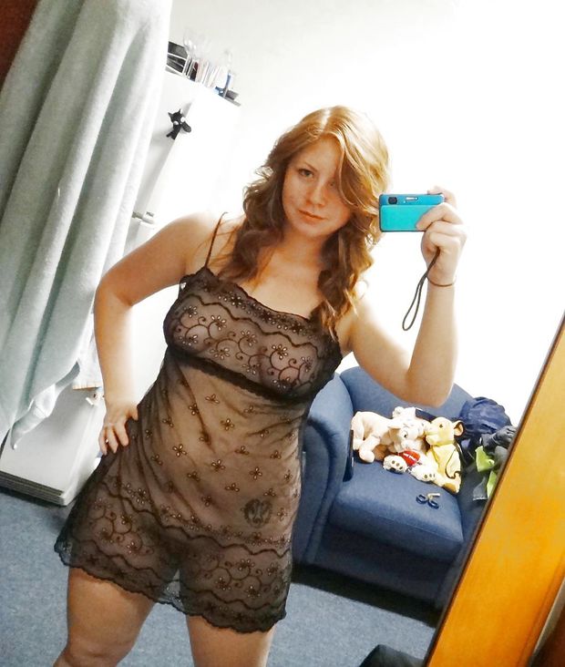 Cute young redhead takes selfie