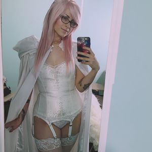 Sexy, pink haired hottie in white lingerie & garter belt