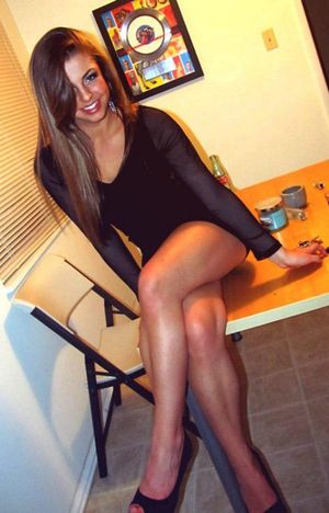 cute girl in black on table
