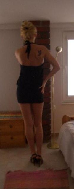 Slim blonde chick from backside in a hotel room