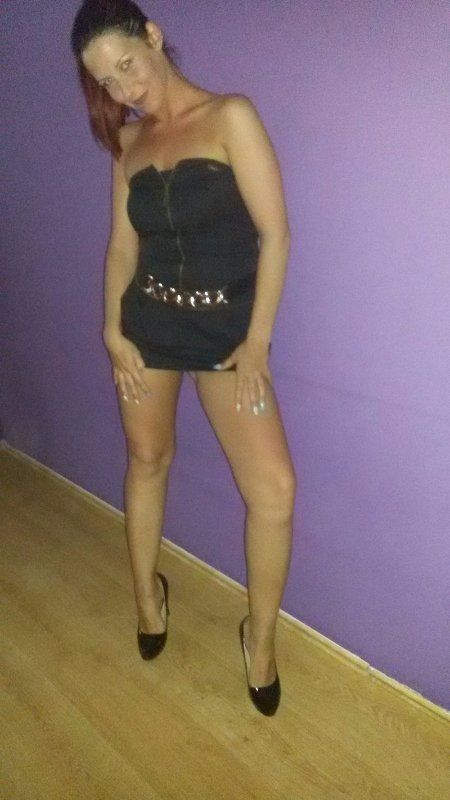 Leggy bimbo in slutty dress before going out looking for fun