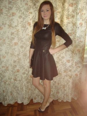 Young babe in leather dress