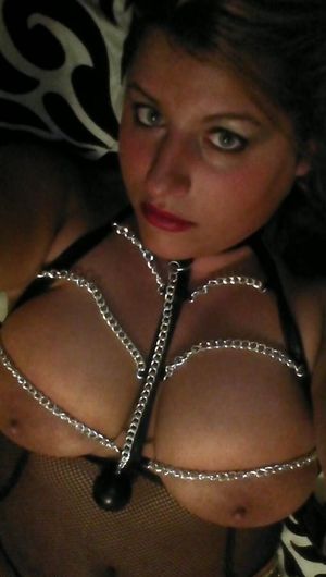 Busty chick in chains