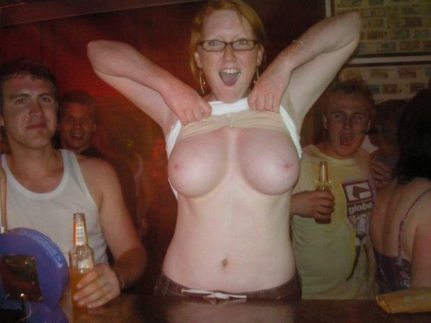 Amateur Redhead with glasses flashes in bar