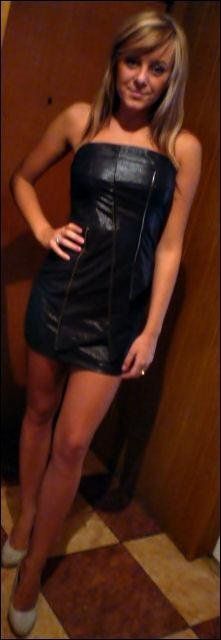 Cute blonde in tight leather dress