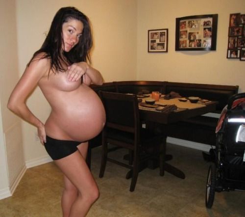 Huge, round belly on this gorgeous girl!