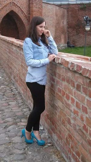 Young babe in blue heels and black yoga pants