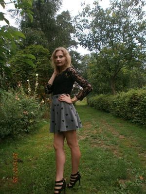 Blonde leggy chick posing outdoors