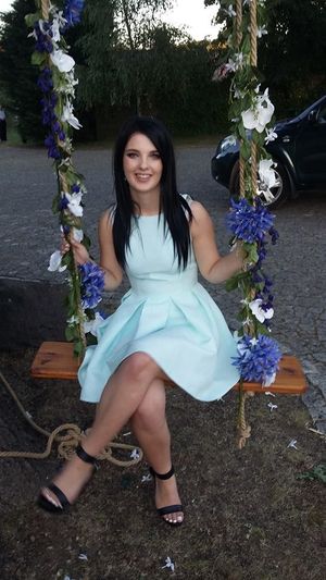 Dark hair babe on a swing