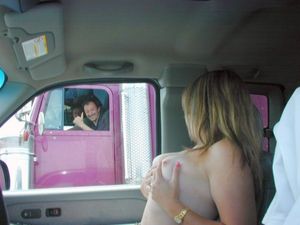 Blonde in car with her tits out