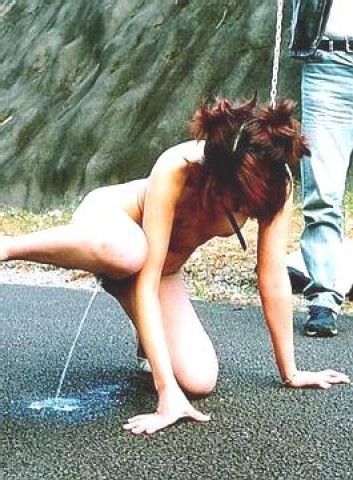 Girl peeing like a dog.