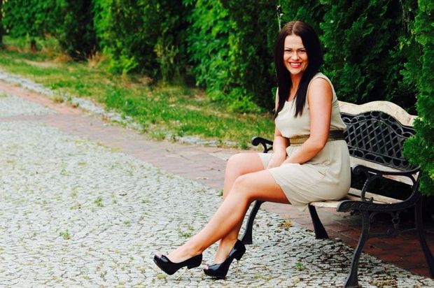 Sexy brunette from a park bench