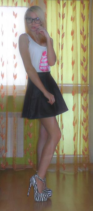 Blonde bimbo posing at home in her new slutty outfit