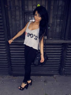 Braless dark hair bimbo posing outdoors