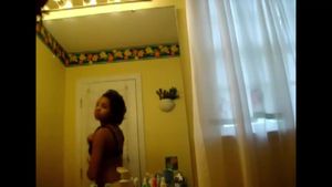 Voyeur - USA. Young black girl checks herself out.