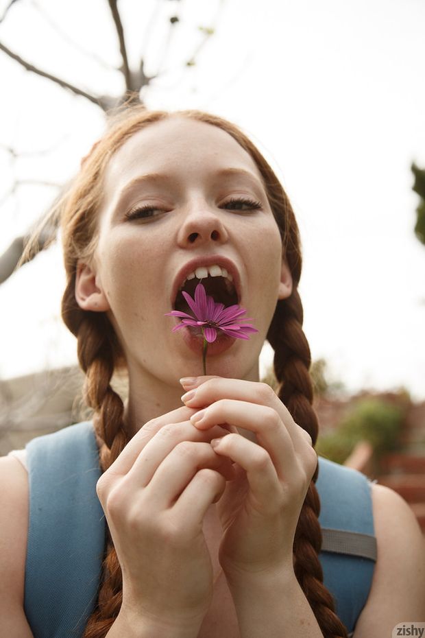 Silly redhead Wendy Patton with braided pigtails