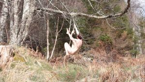 Naked girl with Masters degree in Fine Art ties herself to a...