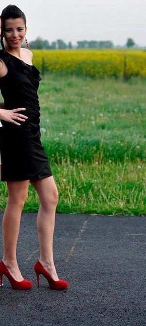 Slim brunette in red heels