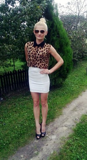 Countrygirl dolled up and posing outdoors