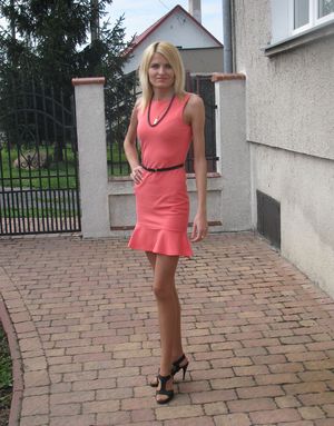 Blonde bimbo outdoors before night out
