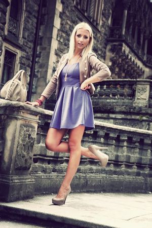 Blonde bimbo posing outdoors