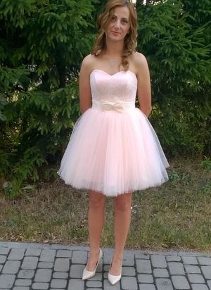 Blonde chick wearing cute pink dress