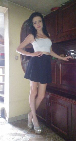 Busty braless chick in tight white top and black skirt