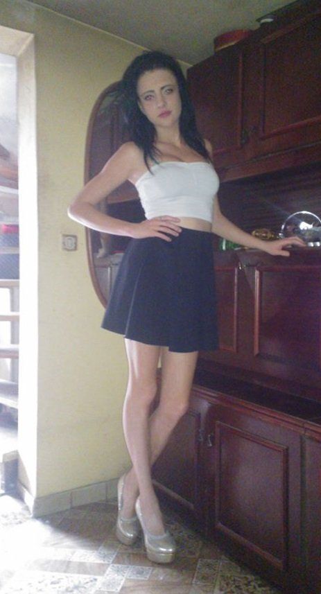 Busty braless chick in tight white top and black skirt