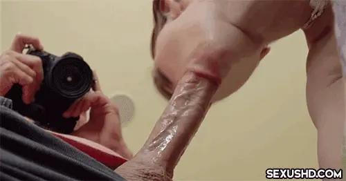 Deepthroating his huge cock and getting a picture of it