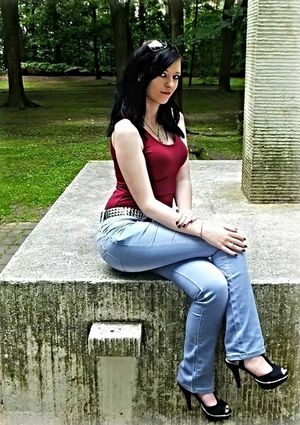 Nice dark hair chick posing in the park