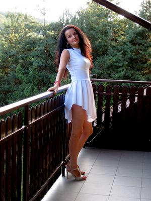 Busty chick in short white dress
