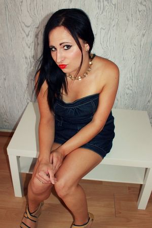 Dolled up dark hair bimbo in short tight dress