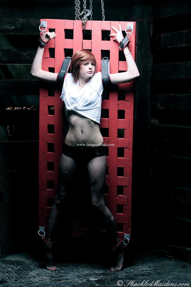 Shackled Maidens - SM605 - Lottie Suspended on the Prison Bed