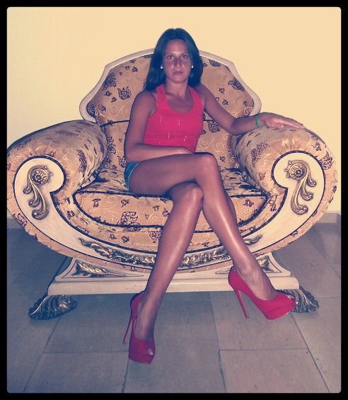 Tanned leggy chick wearing red peeptoe heels
