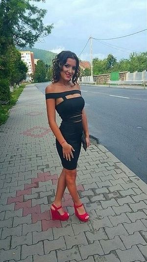 Nasty tanned teaser on the street bra and pantyless in tight black dress and sexy red wedges