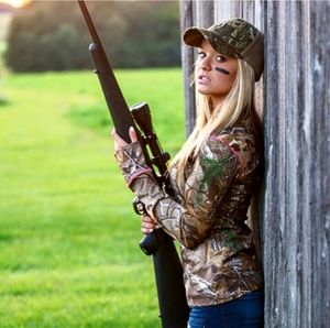 Young blonde hunter with rifle