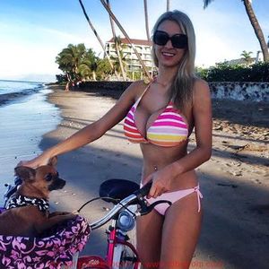 Hot blonde babe with huge tits in the beach