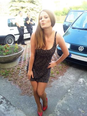 Busty chick posing outdoors