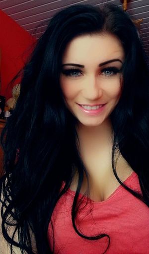 Cute dolled up dark hair bimbo face