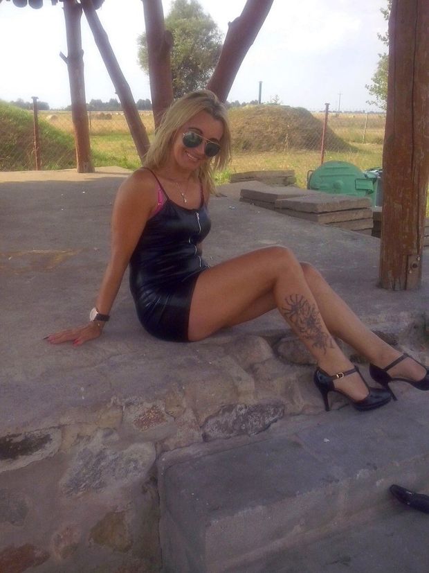 Hot milf in slutty short latex dress with zipper, hooking outdoors