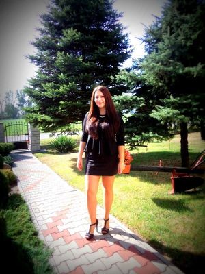 Sexy brunette in really tight skirt outdoors