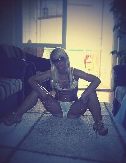 Nasty blonde bimbo at home in white lingerie