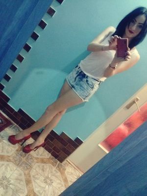 Dark hair doll taking a selfie