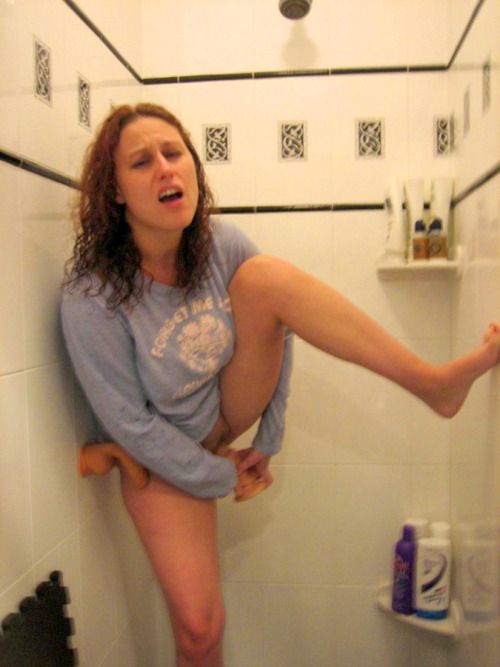 Girlfriend pleasing her snatch with a dildo