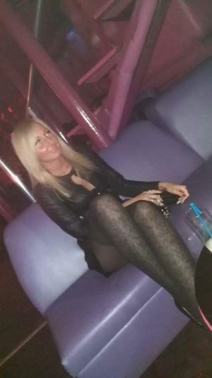 Blonde bimbo at the party in the nightclub