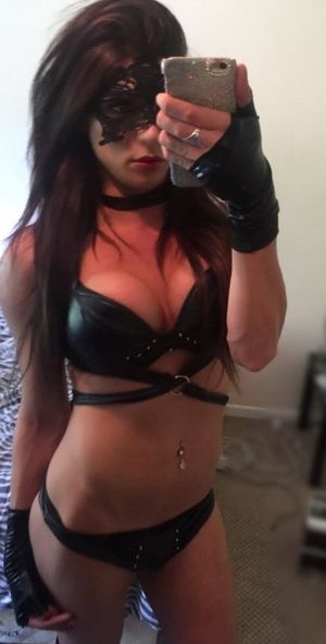 Masked chick in sexy leather outfit