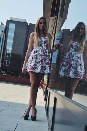 Leggy blonde outdoors