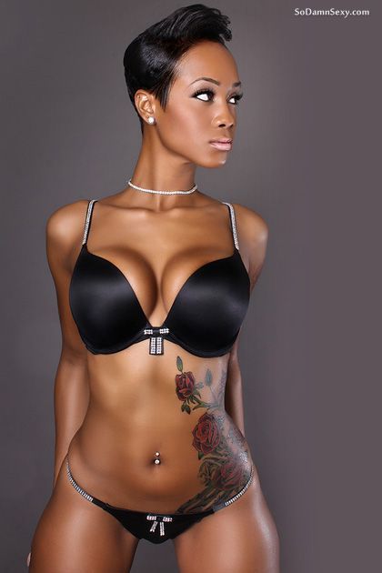 Stunning tattooed black lingerie babe